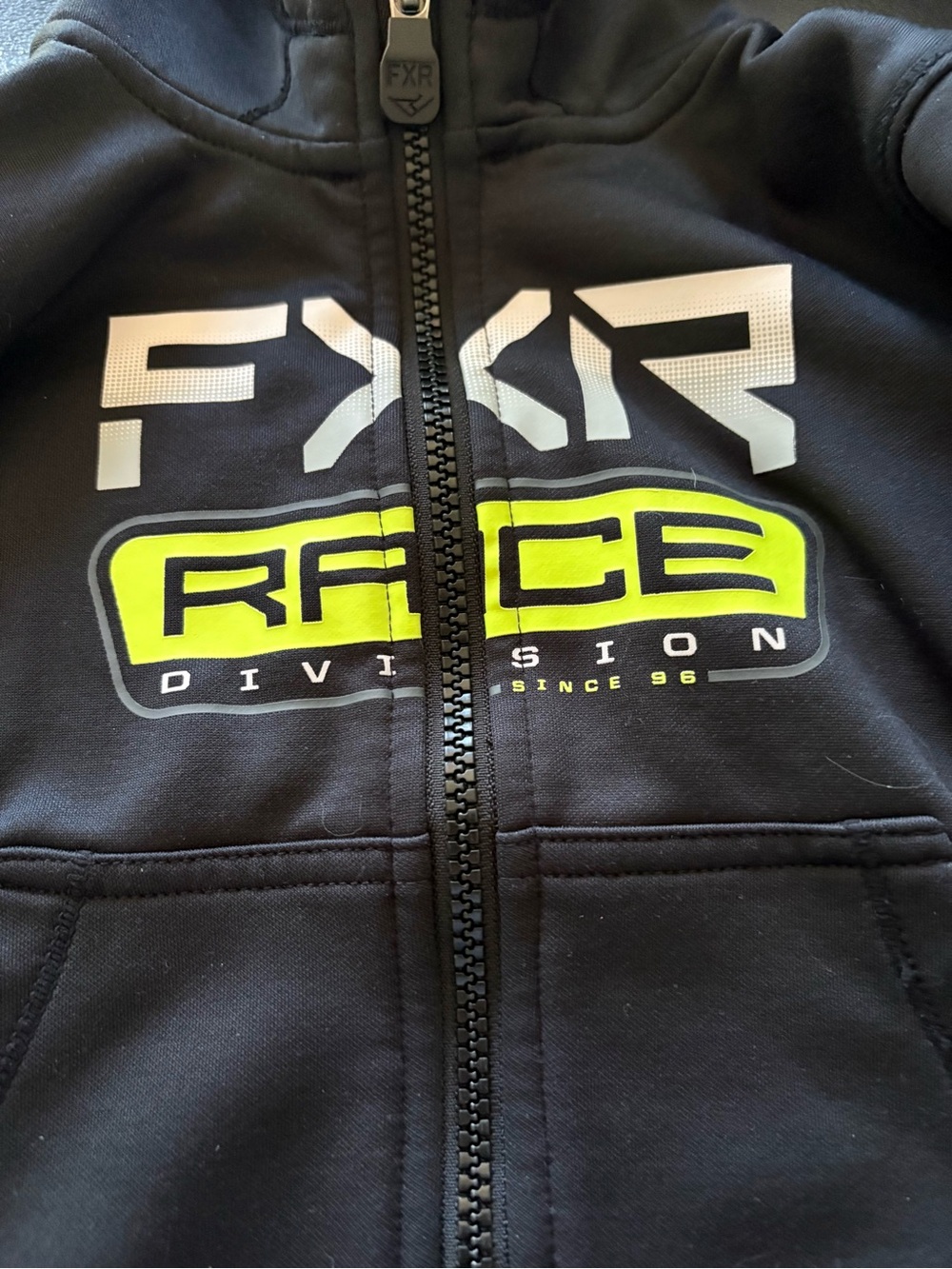 FXR Race Division Black Zip Hoodie with Neon Yellow Logo